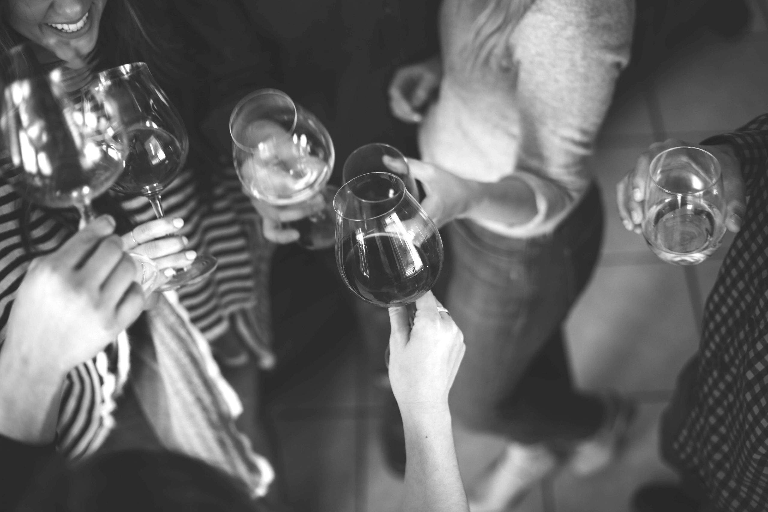 Young professionals holding wine glasses