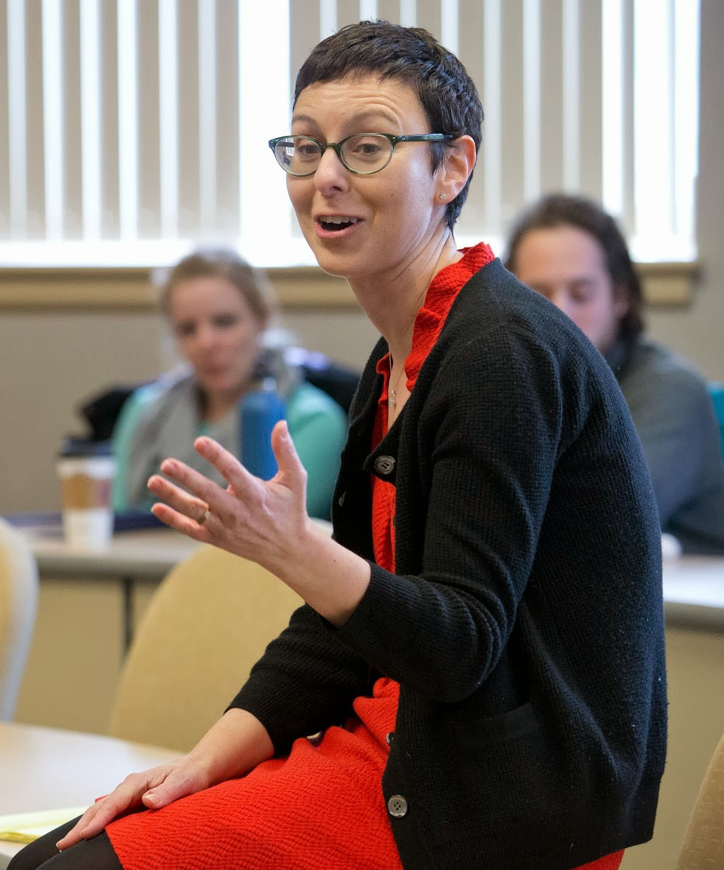 Professor Andrea Monroe speaking to a class of students