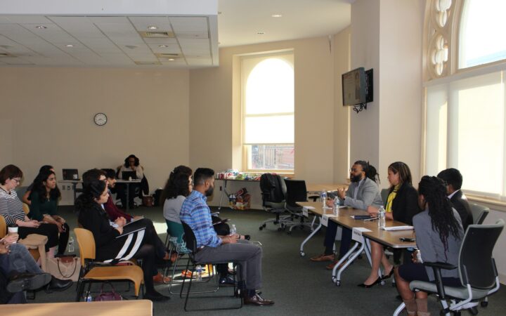 students listen to panelists at the professional development academy